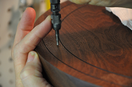 Carving decoration into footstool seat