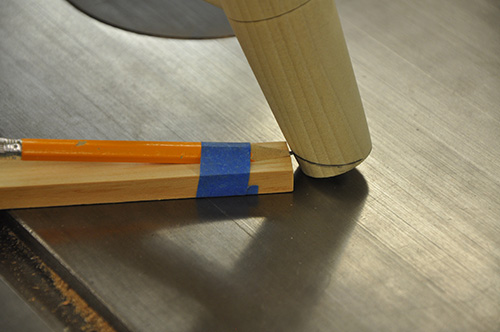 Scribing cutoff marks on stool legs to sit on floor