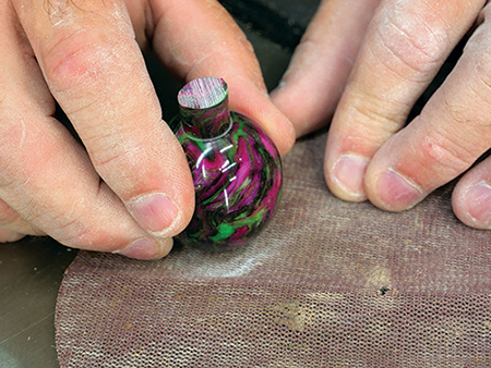 Sanding off bottom tenon on ornament turning