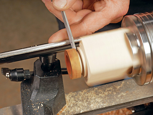 Separating turned ring shape from rest of blank