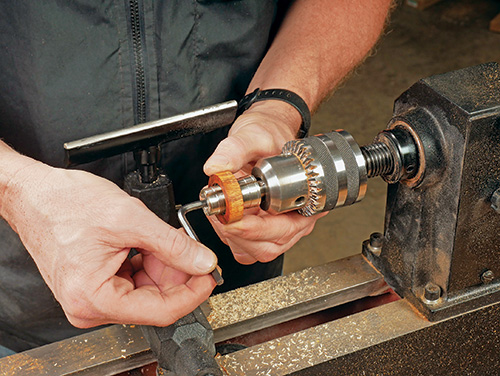 Mounting ring turning blank on ring mandrel