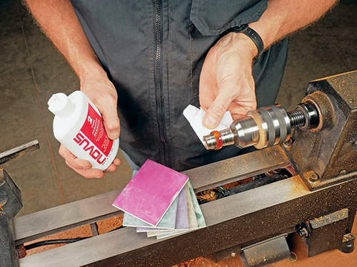 Running polish over surface of ring turning