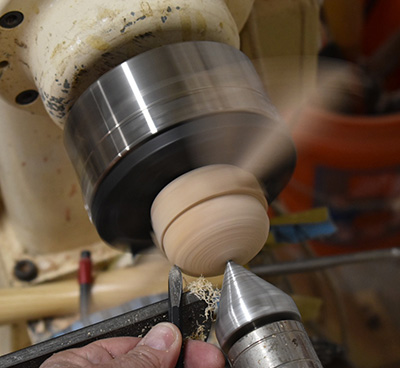 Smoothing bottom of tea strainer cup