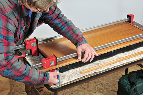 Clamping upholstery cover in place during installation