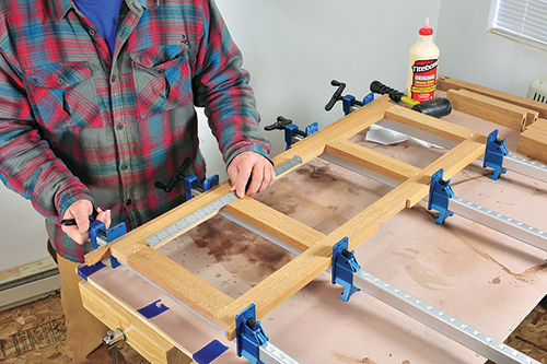 Clamping together ottoman side panel frame