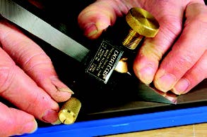 A knurled wheel on the Veritas Precision honing guide resets its eccentric roller to a higher angle for honing a secondary bevel.