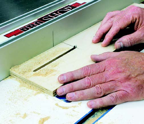 Cutting slot in base piece for drill press fence