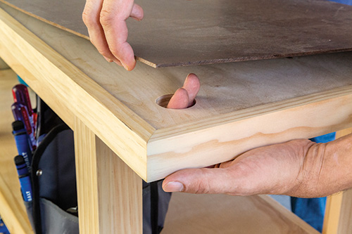 Access hole in workbench for removing tabletop