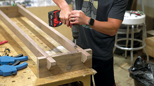 Assembling walnut storage cabinet base