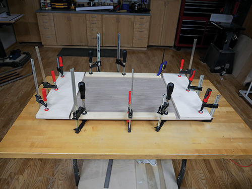 Clamping veneer sheet to waterfall desktop