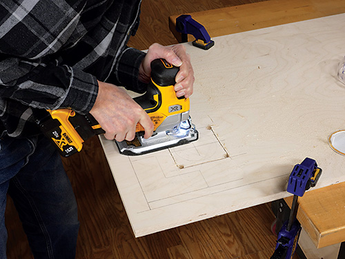 Cutting away charger installation point with jigsaw