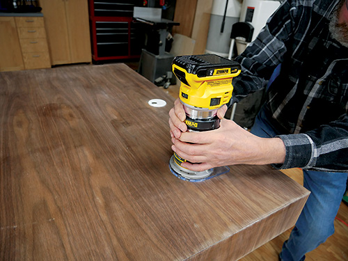Trimming veneer around wireless charger hole with flush trim router