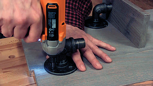 Attaching black pipe shelf supports with screws