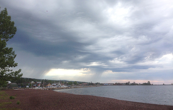 The way the light is illuminating Grand Marais, captivates my sentiments on the sleepy little town. I camped in the campground that is next to NHFS, and it is directly behind me in this photo. You can walk to the school (red and blue buildings on the left) and most places in town. The weather changes often, and so be prepared for a range of weather conditions.