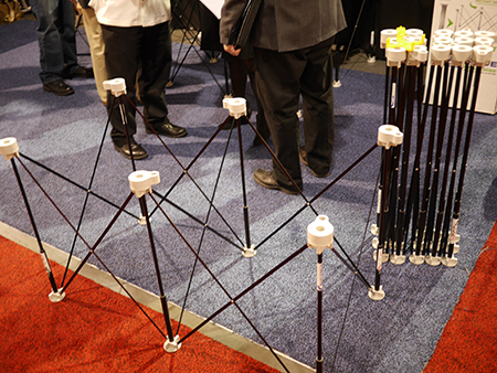 The 2x4 ft. Centipede Sawhorse ready for use with the 4x8 ft. Centipede Support XL collapsed in the background.