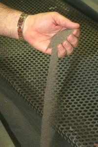 img_3082 Here, 60-grit waits in a hopper to be electrostatically charged and bonded to substrate paper.