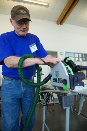 n333IIBlueShirtGuySawing