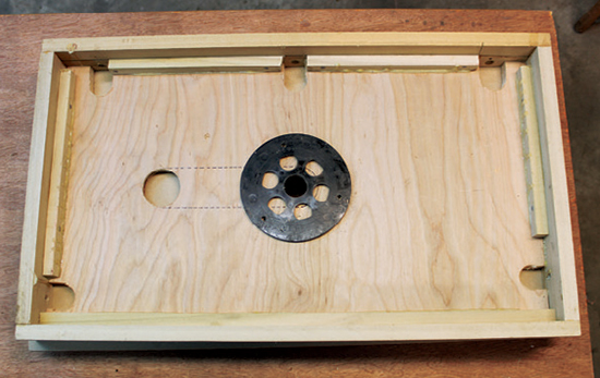 Your router’s baseplate makes an excellent template for determining where to drill the attachment screws for the router base.