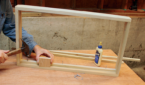 Install ledges inside the table framework to support the bottom plywood layer. Use a scrap depth gauge to locate the ledges accurately.