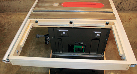 Bolt the frame to the saw table and rip fence rails to check its fit. The bolt holes should be large enough to allow for some fine-tuning.